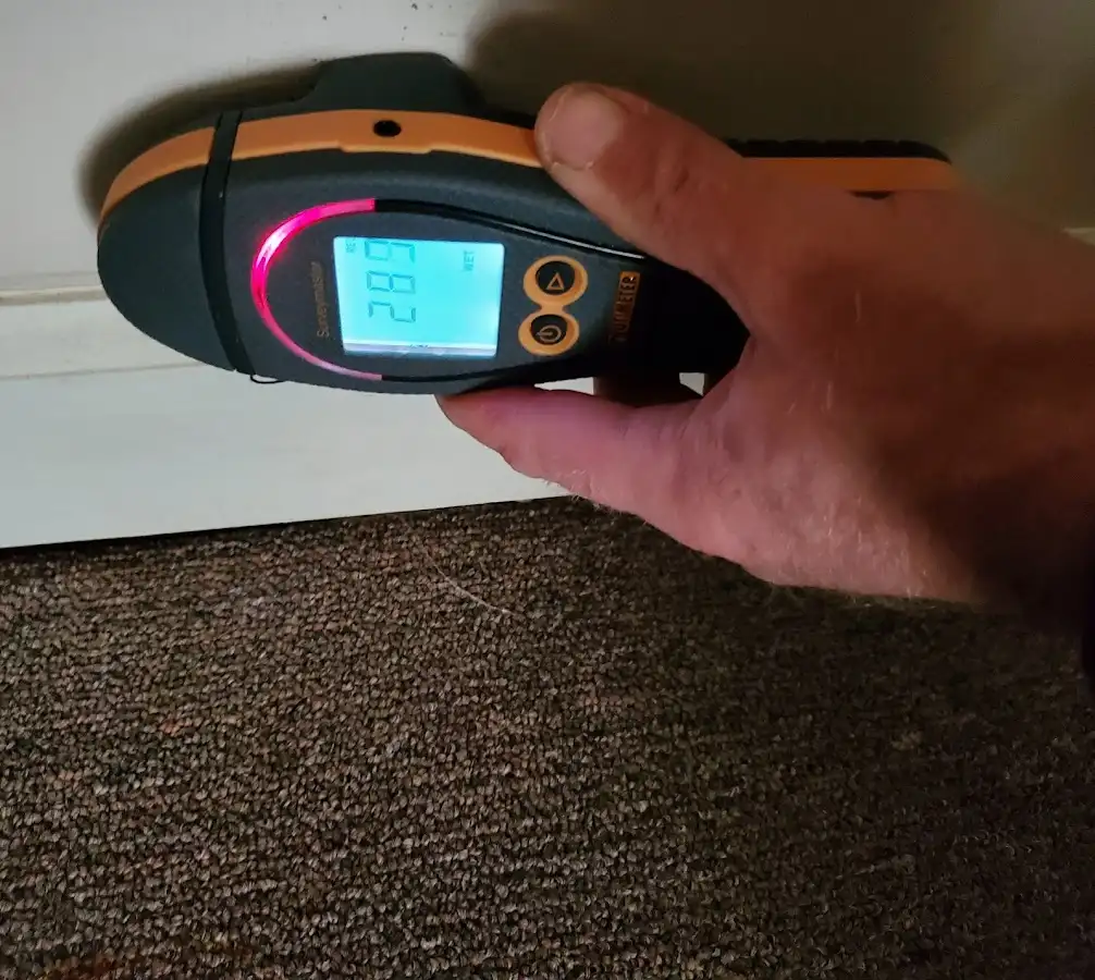 Moisture detection at baseboard during Storm Damage Restoration in Blue Ash